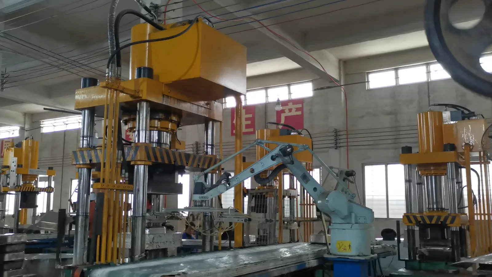 A closer view of food pan forming equipment at the SEEKTAY factory